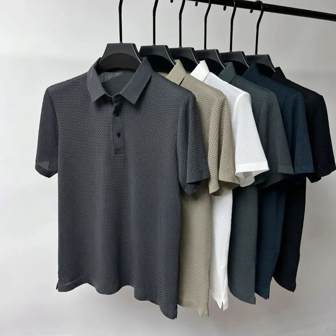 The Wimbledon Performance Polo — lifestyle view styled with chinos for smart casual occasions